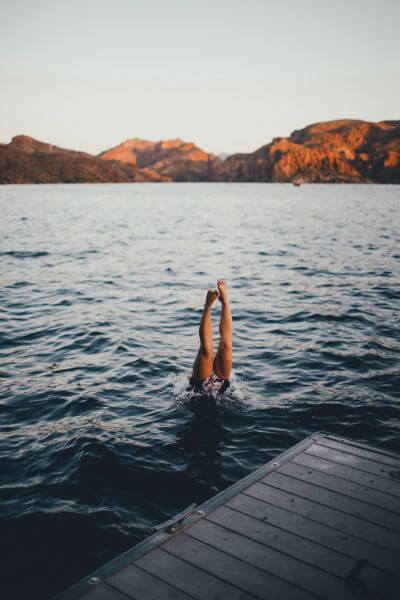 Person diving into the sea swimming